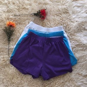 Three pairs of soffe shorts! Blue, purple, & white
